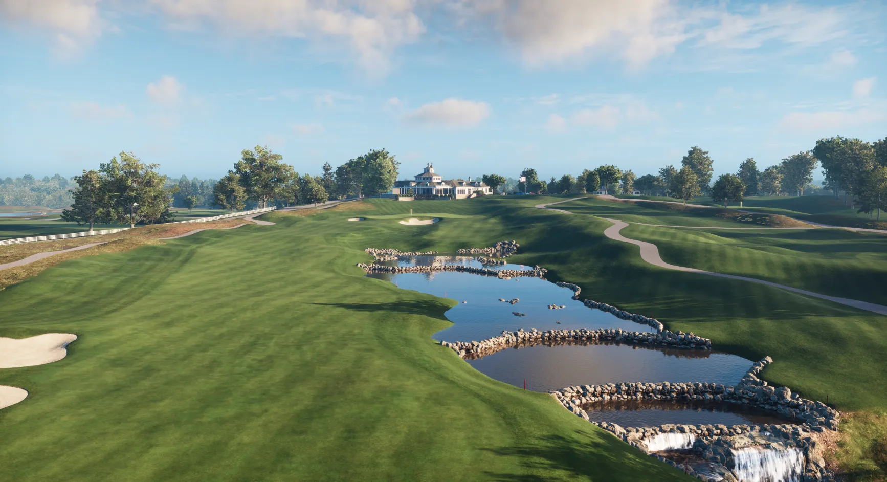 Valhalla golf course with lush green fairways, sand traps, a pond with rocks, and a clubhouse in the distance under a partly cloudy sky.