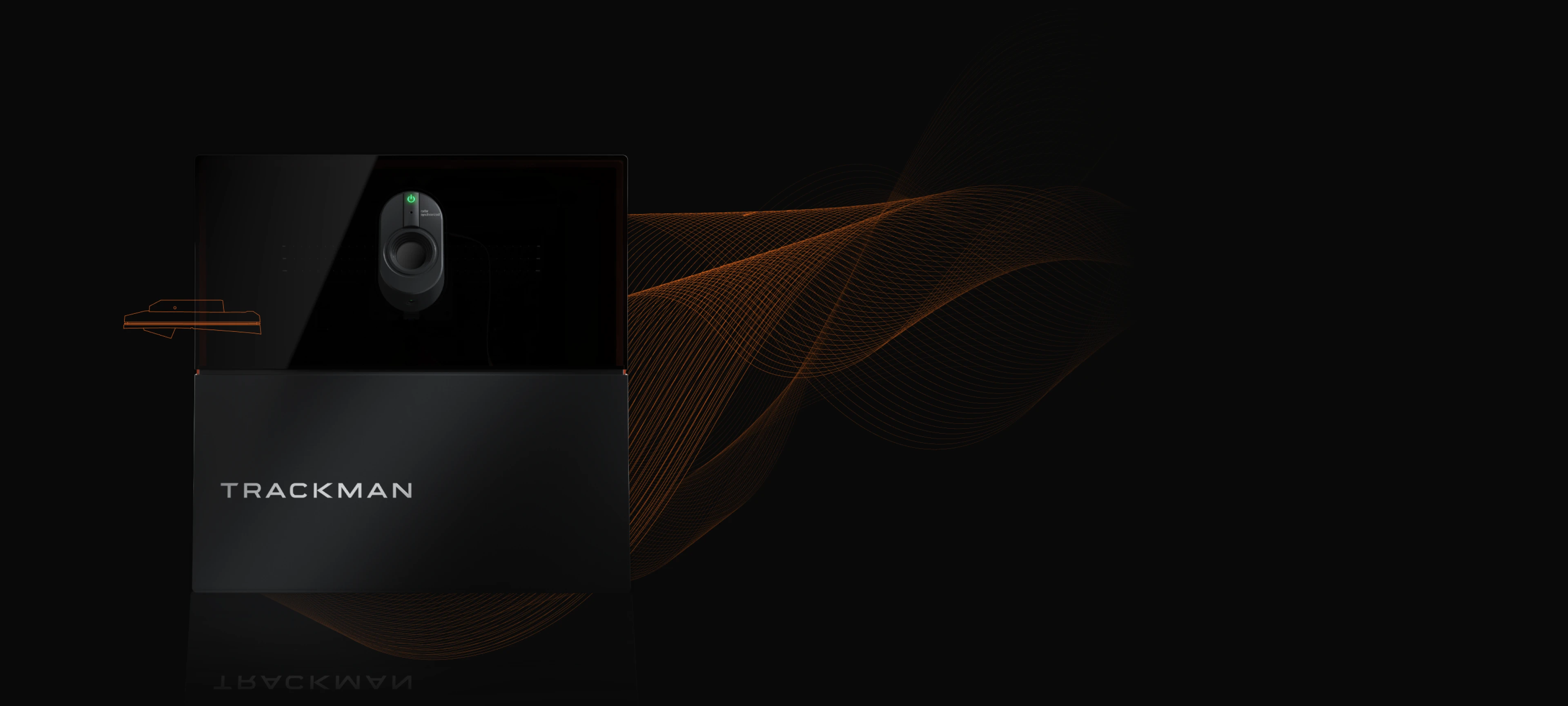 TrackMan device with sleek black design, featuring an illuminated power button and orange wave pattern on a dark background.