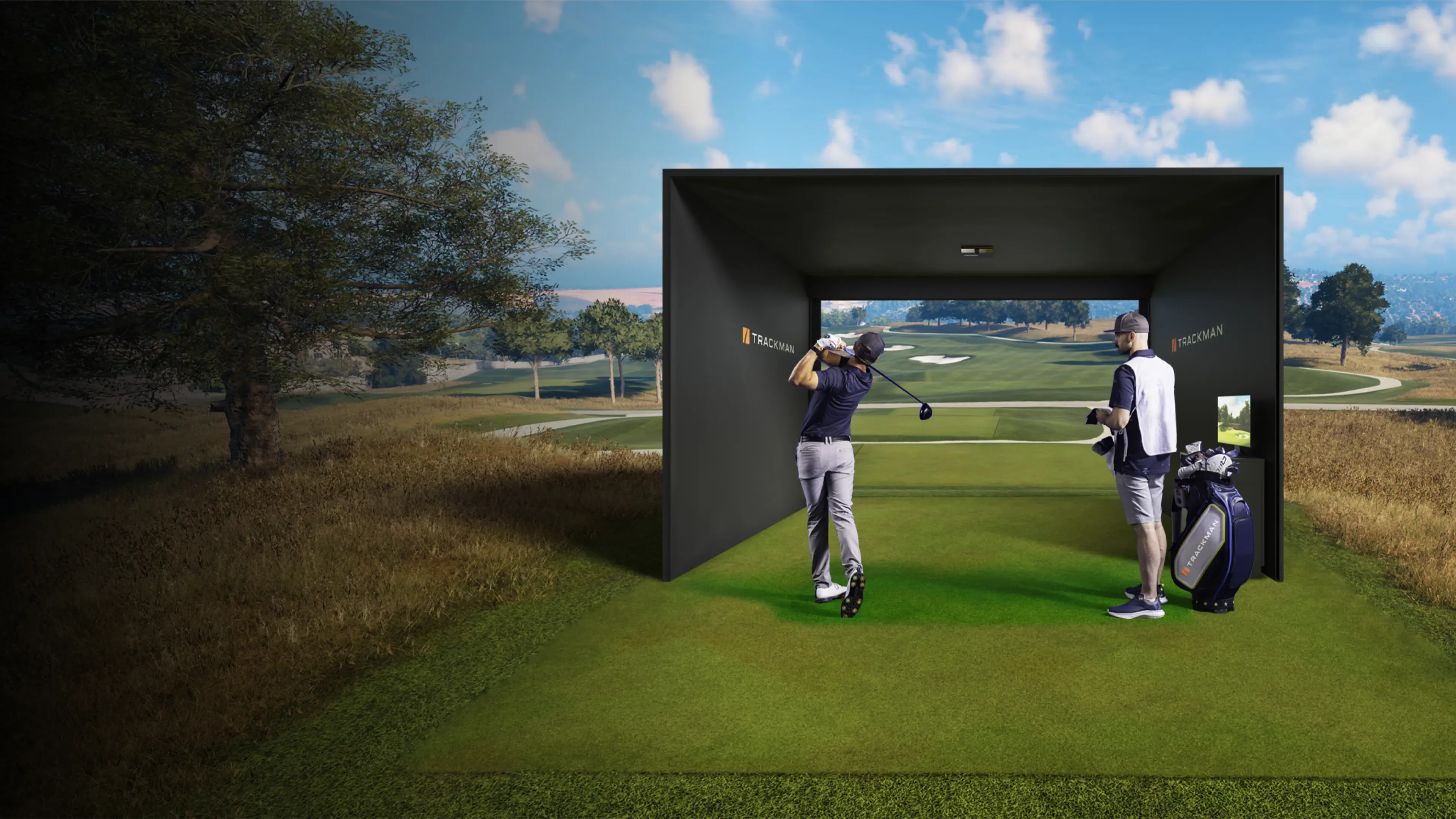 Two golfers practice in a Trackman simulator on a golf course, with clear skies and a scenic landscape in the background.